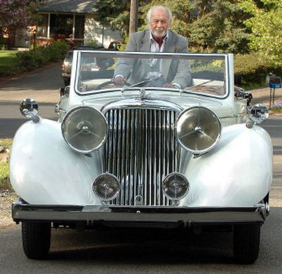 
D.W. Brown, 81, looks over the windshield of his 1948 Jaguar at his home in University Place, Wash., on Monday.
 (Associated Press / The Spokesman-Review)