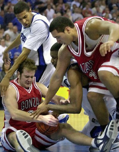 Memphis' Chris Douglas-Roberts, top, and Shawne Williams fight Gonzaga's Sean Mallon, bottom, and J.P. Batista for a loose ball.
(Associated Press / The Spokesman-Review)