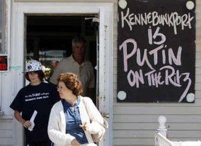 
Customers leave a Kennebunkport, Maine, restaurant Friday displaying a sign welcoming Russian President Vladimir Putin, who will be in town today and Monday at the Bush family compound. Associated Press
 (Associated Press / The Spokesman-Review)