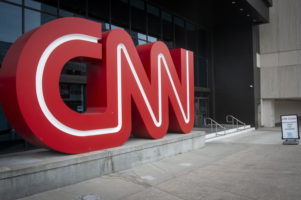 The CNN logo is displayed at the entrance to the CNN Center in Atlanta on Wednesday, Feb. 2, 2022. CNN’s Jeff Zucker’s abrupt exit this week after failing to disclose a workplace relationship is yet another reminder that companies should have a firm policy in place when workplace relationships arise, even in the C-Suite.  (Ron Harris)