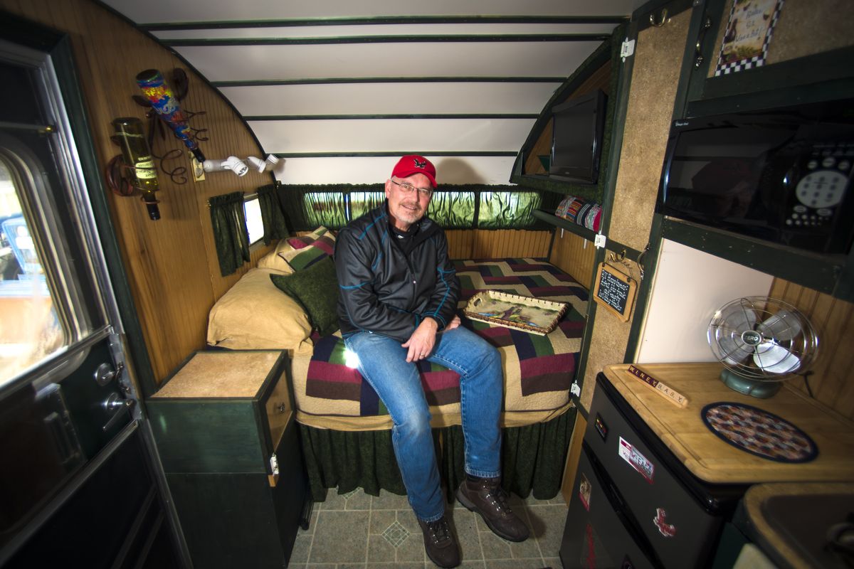 Doug Johnson, who recently retired from Central Pre-Mix, sits in the 1956 Aloha travel trailer he restored. (Colin Mulvany)