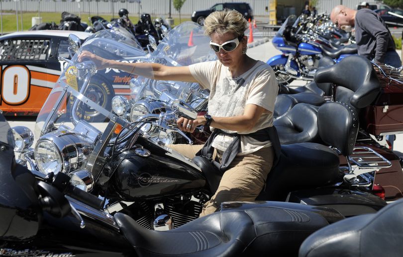 Alison Cassem and her husband, Bruce, check out used bikes Friday at Lone Wolf Harley-Davidson in Spokane Valley. (Dan Pelle)