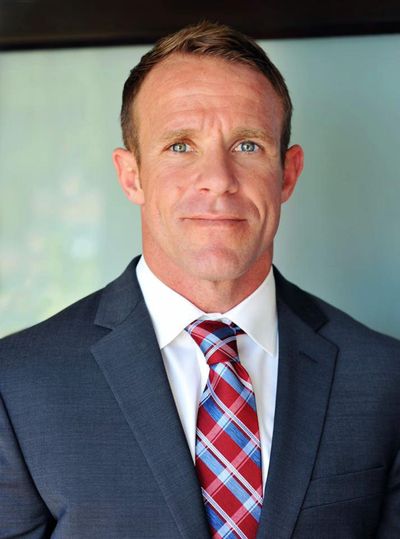 This 2018 photo provided by Andrea Gallagher shows her husband, Navy SEAL Edward Gallagher. The decorated Navy SEAL is facing charges of premediated murder and other offenses in connection with the fatal stabbing of a teenage Islamic State prisoner under his care in Iraq in 2017 and the shooting of unarmed Iraqi civilians. (Andrea Gallagher / AP)