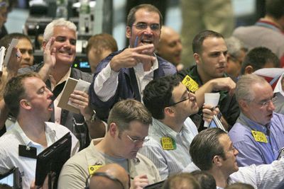 Traders work the crude oil futures pit at the New York Mercantile Exchange on Thursday.  (Associated Press / The Spokesman-Review)