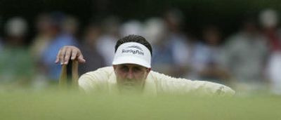 
Phil Mickelson, who hit just eight of 18 greens on Friday, studies his putt on the third green during second-round play of the U.S. Open at Pinehurst No. 2. 
 (Associated Press / The Spokesman-Review)