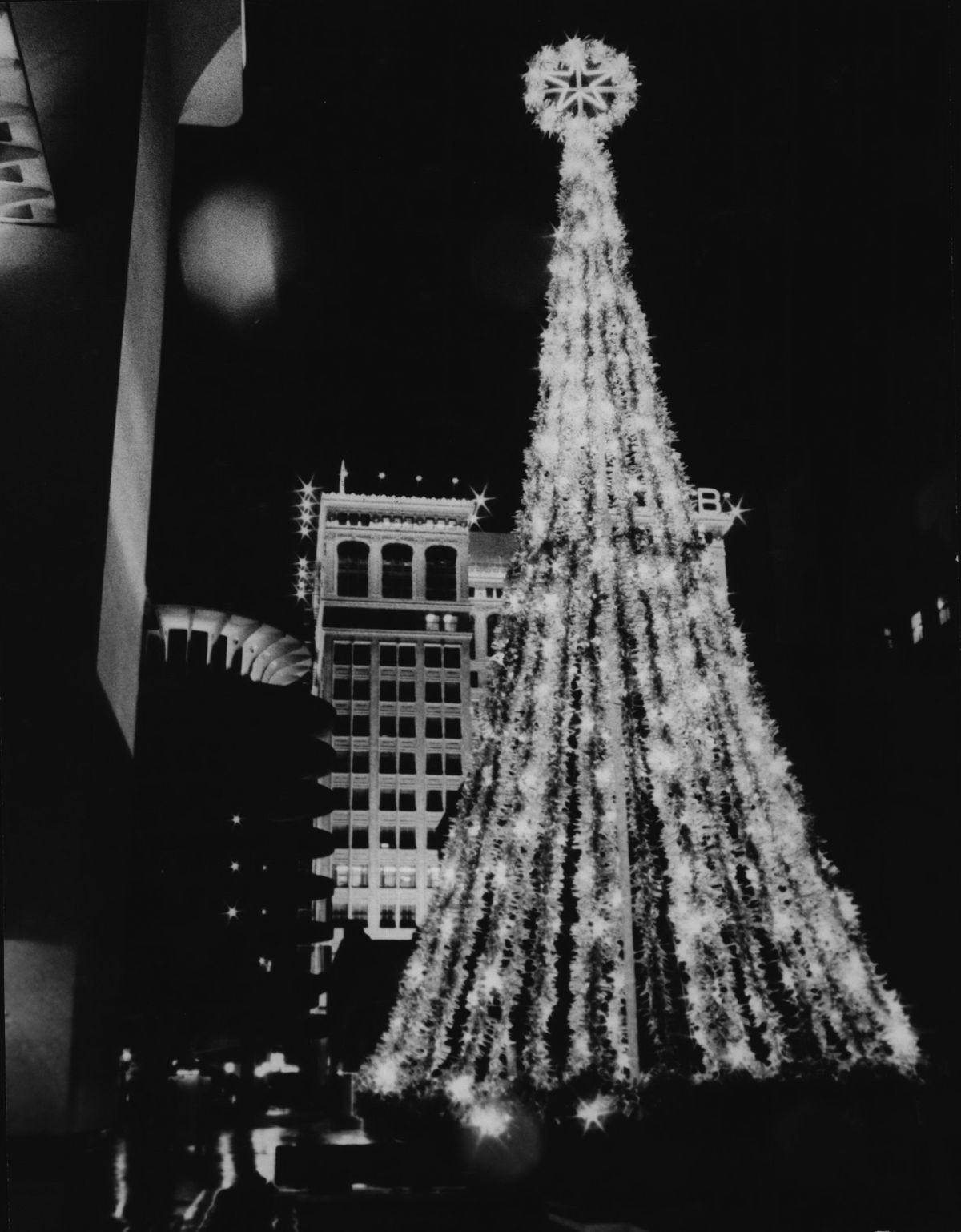 1971: A brightly lit Christmas tree glows in the Parkade Plaza near the futuristic Parkade parking structure in downtown Spokane. The modern parking garage, designed by architect Warren Heylman, received a national award for “excellent in the use of concrete.” Heylman designed the plaza with a large fountain, though the bowl-like top fountain was demolished in 2014 and the lower pool filled in as a planter. Behind the tree is the Old National Bank building, which was Spokane’s tallest building from 1910 until 1929.  (Spokesman-Review Photo Archives)