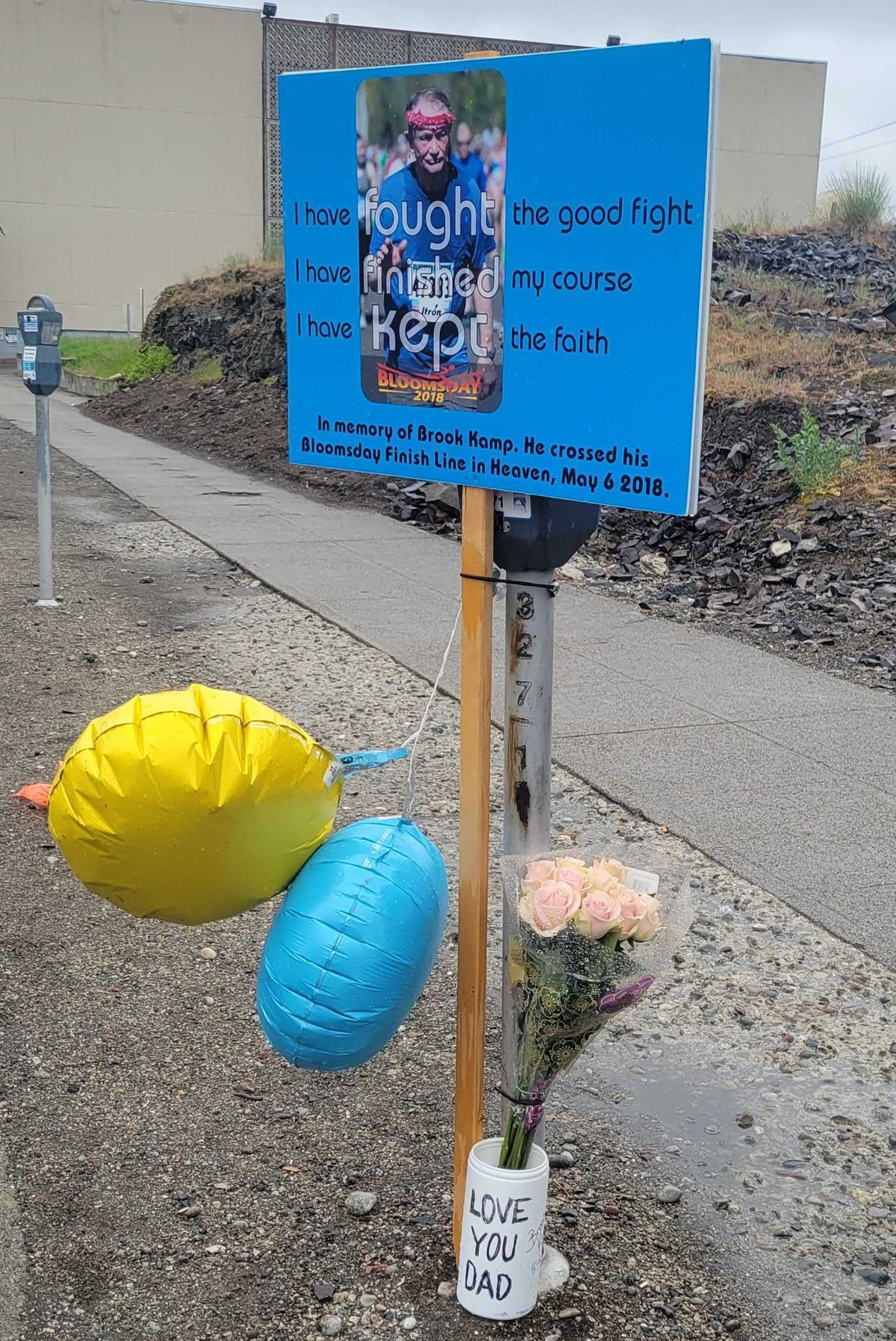Brook Kamp, pictured in this memorial on the Bloomsday course Sunday, died of a heart attack while racing in Bloomsday 2018.  (Nick Gibson/The Spokesman-Review)