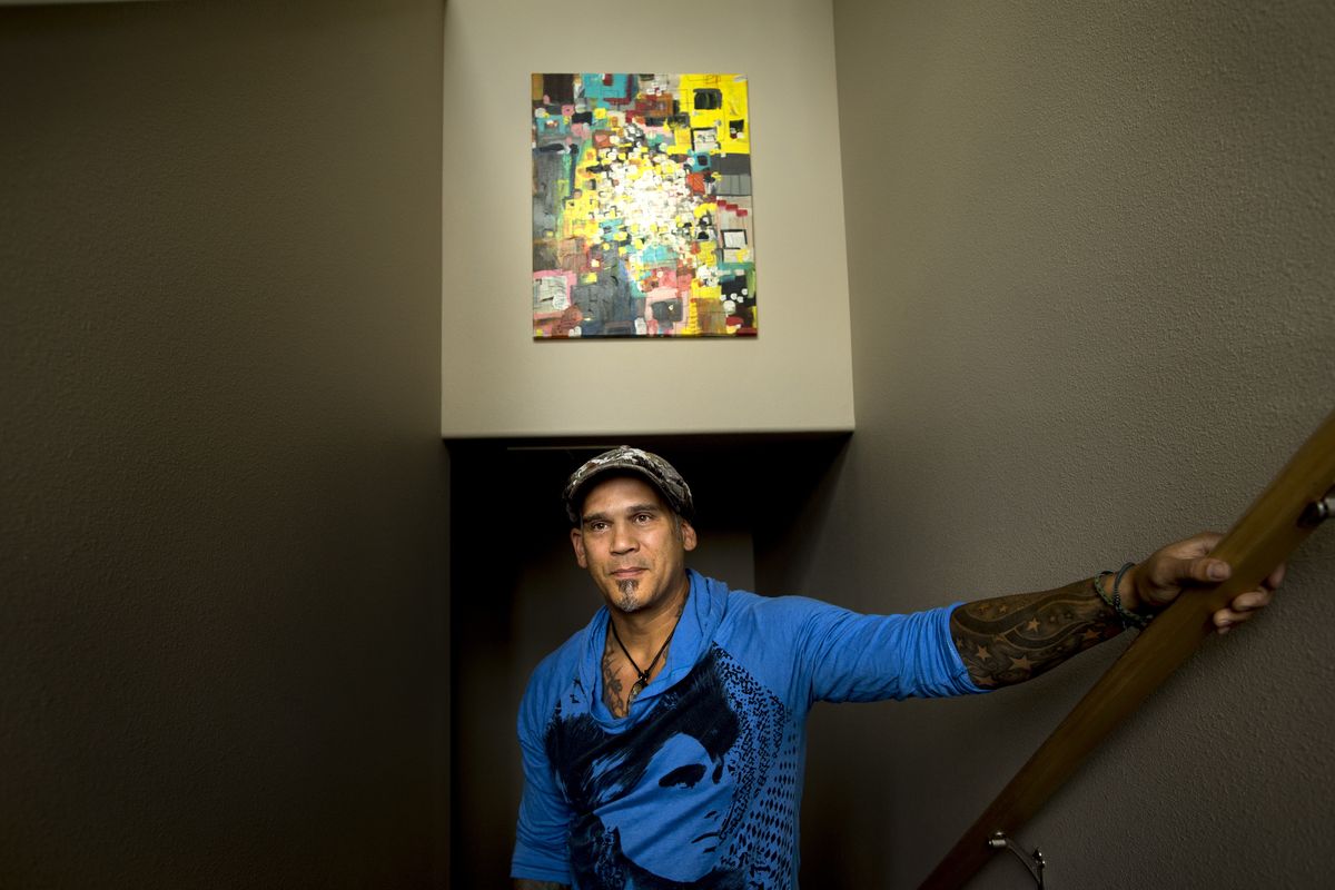 Artist Nate O’Neill poses for a photo on Oct. 1 at his home in Spokane. (Tyler Tjomsland)