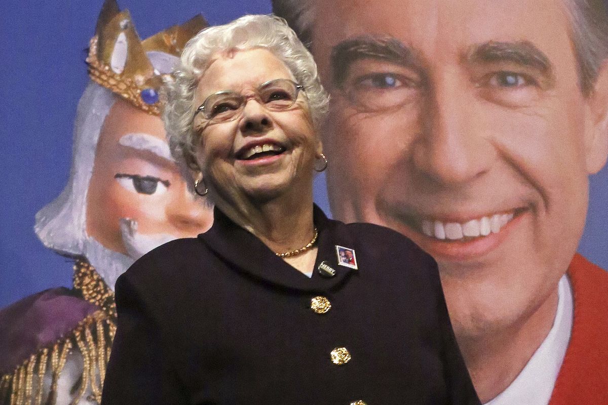 Joanne Rogers stands in front of a giant Mister Rogers Forever Stamp in 2018 following the first-day-of-issue dedication in Pittsburgh.  (Gene J. Puskar)