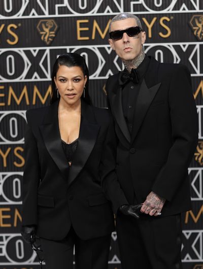 Kourtney Kardashian, left, and Travis Barker arrive for the 75th Primetime Emmy Awards at the Peacock Theater in Los Angeles on Jan. 15.  (Jay L. Clendenin/Los Angeles Times/TNS)