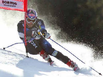 
Bode Miller clears a gate on his way to winning the men's super-G in Italy.
 (Associated Press / The Spokesman-Review)