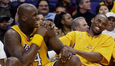 
Shaquille O'Neal, left, and Kobe Bryant shared a laugh on the Lakers' bench last season during a game against the Nuggets.
 (Associated Press / The Spokesman-Review)