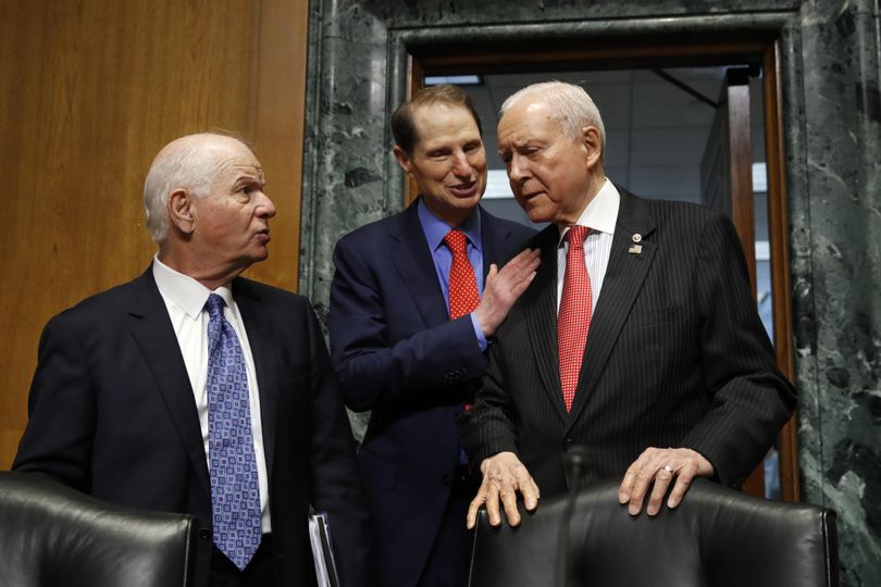 Sen. Ben Cardin, D-Md., left, talks with Ranking Member Sen. Ron Wyden, D-Ore., and Senate Finance Committee Chairman Orrin Hatch, R-Utah, right, at the start of a committee hearing on Thursday, Sept. 14, 2017, on Capitol Hill in Washington. On Wednesday, the panel, which also includes Idaho Sen. Mike Crapo and Washington Sen. Maria Cantwell, will take up a proposal to reauthorize the Children’s Health Insurance Program, for which funding has now expired. (Jacquelyn Martin / AP)