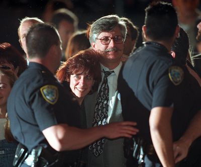 Fred Goldman, center, and his wife, Patti, leave a courthouse in Santa Monica in 1997 after a jury found football star O.J. Simpson guilty in a civil trial involving the slaying of Goldman’s son, Ronald.  (Gina Ferazzi/Los Angeles Times/TNS)