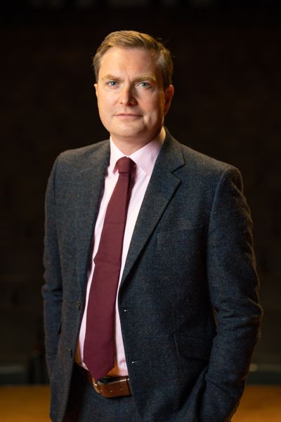 James Lowe, Spokane Symphony music director, stands for a portrait at Martin Woldson Theater at the Fox on Sept. 2.  (Colin Mulvany/The Spokesman-Review)