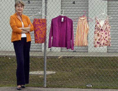 
Sandy Haase displays some of the pieces in the Weekenders spring-summer collection that she sells locally.
 (Liz Kishimoto / The Spokesman-Review)