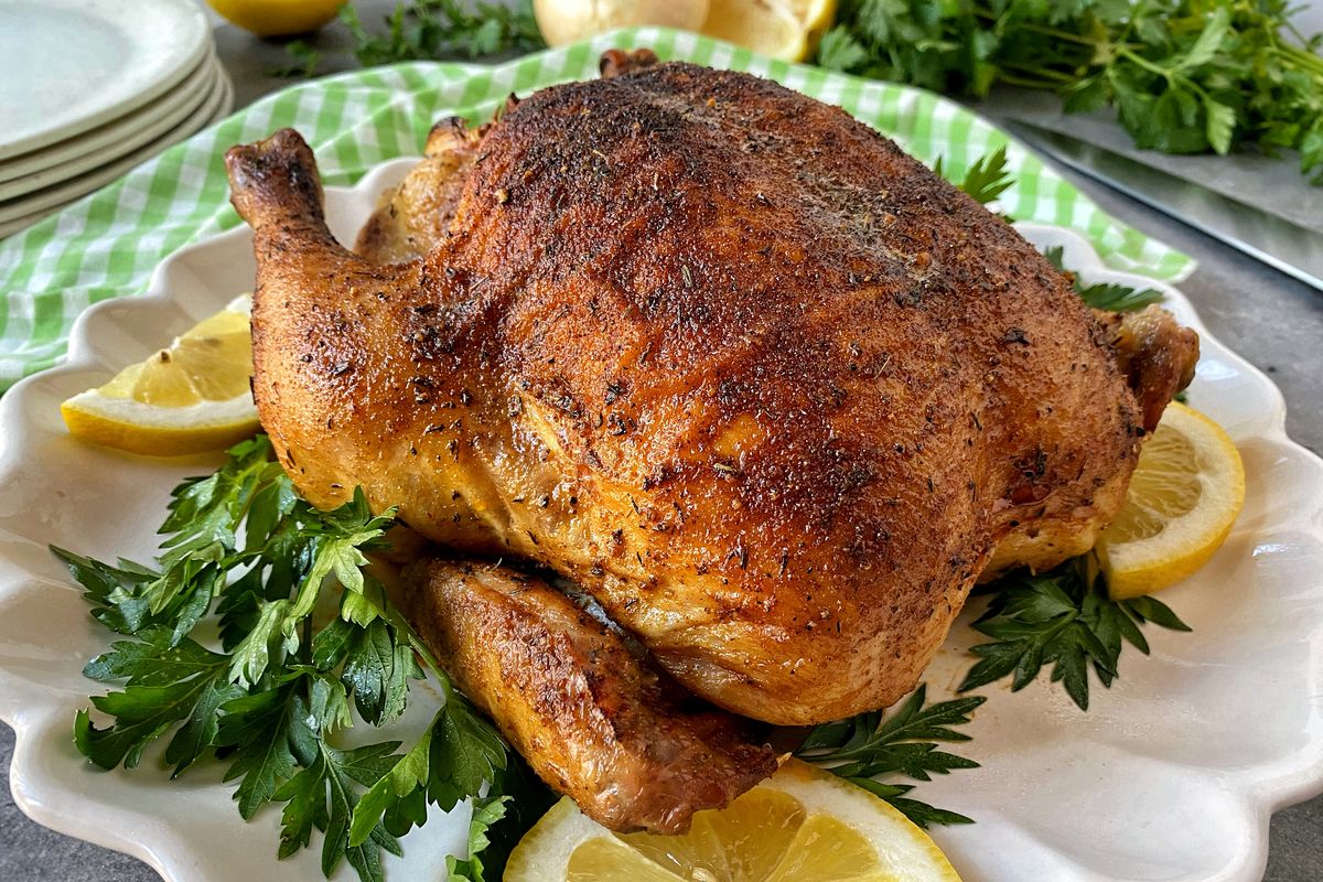 National Rotisserie Chicken Day is June 2. With this recipe, however, the bird can be prepared in an oven for similar results.  (Audrey Alfaro/For The Spokesman-Review)