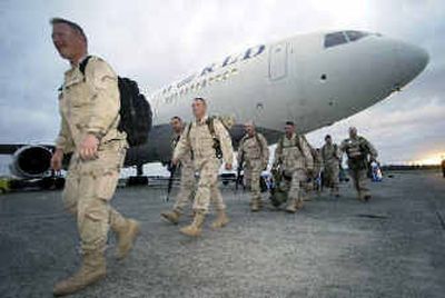 
Members of Oregon and Washington National Guard arrive at McChord Air Force Base near Tacoma on Thursday. 
 (Associated Press / The Spokesman-Review)