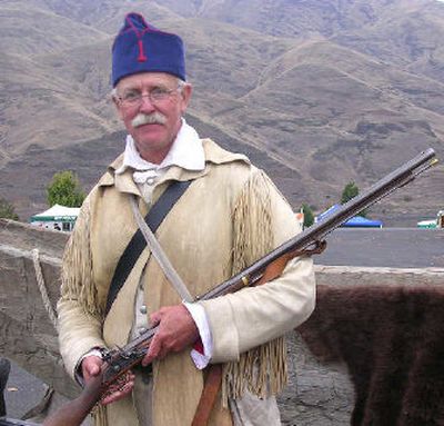 
Living history presenter Steve Morehouse of Montana stands with his gun and canoe during a national traveling exhibit program.
 (Photo by Nancy Lemons / The Spokesman-Review)