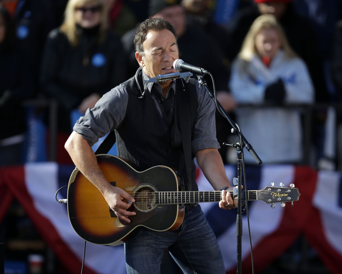 Singer Bruce Springsteen performs before the start of a campaign event for President Barack Obama near the State Capitol Building in Madison, Wis., Monday, Nov. 5, 2012. (Pablo Monsivais / Associated Press)
