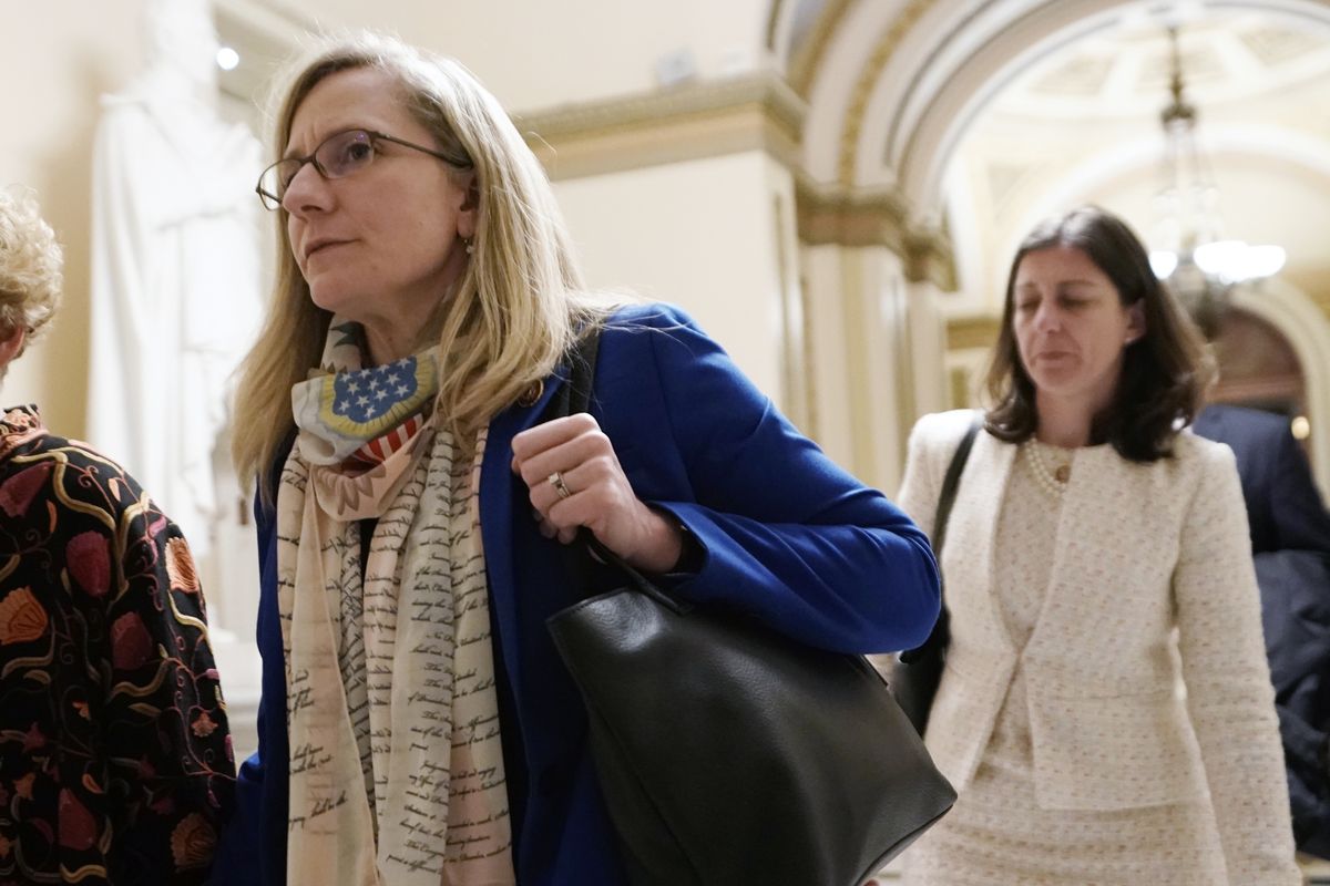 FILE - In this Dec. 18, 2019 file photo, Rep Abigail Spanberger D-Va., left, and Rep Elaine Luria. D-Va., walk at the Capitol in Washington. The U.S. Chamber of Commerce has decided to endorse 23 freshmen House Democrats in this fall’s elections. The move represents a gesture of bipartisanship by the nation
