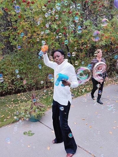 Black Lens contributor Teresa Brooks has fun with some bubbles.  (Courtesy)
