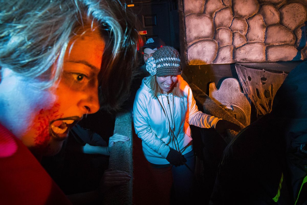 Emma Smart, 15, on left, playing Dracula’s bride, scares visitors to the Post Falls Lions Haunted House on Saturday, Oct. 21, 2017. The Lions Haunted House has been the primary fundraiser for the club for over three decades. Thousands of dollars each year go directly back to the community. (Colin Mulvany / The Spokesman-Review)