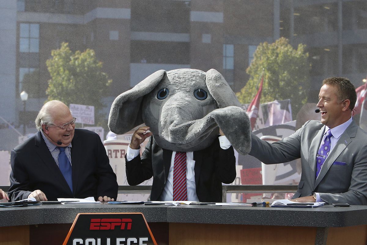 In this Oct. 22, 2016 photo, ESPN's Lee Corso wears Big Al's mascot head after picking Alabama to win over Texas A&amp;M as Vern Lundquist, left, and Kirk Herbstreit laugh on the set of ESPN's College GameDay outside Bryant-Denny Stadium in Tuscaloosa, Ala. The Par 3 Contest is out at the spectator-free Masters in November. ESPN's “College GameDay” is in. Augusta National announced Tuesday, Oct. 27, 2020, more changes to a Masters tournament that will be unlike any of the previous 83. The most unusual of all is ESPN's popular college football pregame show taking place on a stage that overlooks Ike's Pond and the ninth green of the Par 3 course.  (Erin Nelson)