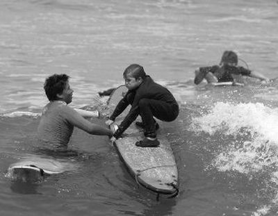 
Surfing caught on with Lima's youth after the success of 2004 female world champion Sofia Mulanovich. 
 (Associated Press / The Spokesman-Review)