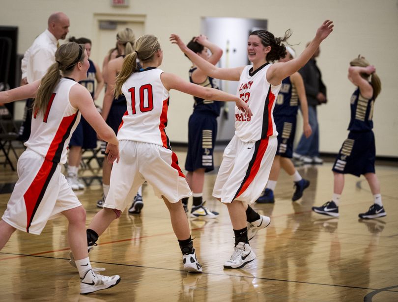 West Valley's celebrates their 47-44 win over Selah Tuesday, Feb. 19, 2013, at West Valley High School. (Colin Mulvany / The Spokesman-Review)