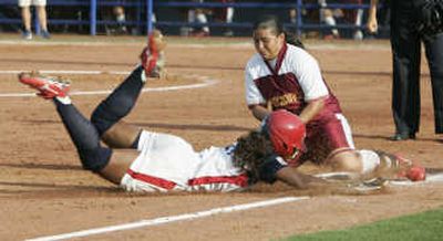 
World Cup softball continues today.
 (Associated Press / The Spokesman-Review)