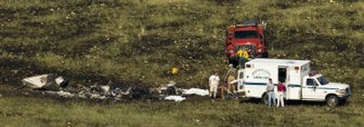 
Sweetgrass County officials work to recover bodies in the aftermath of the plane crash Saturday near Big Timber, Mont. 
 (Associated Press / The Spokesman-Review)