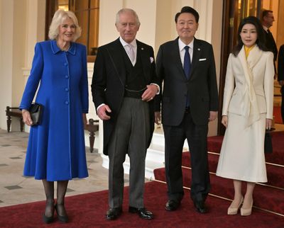 From left, Queen Camilla and King Charles III pose with South Korea’s President Yoon Suk Yeol and first lady Kim Keon Hee during a formal farewell at Buckingham Palace on Nov. 23 in London.  (WPA Pool)