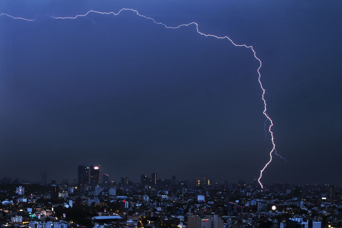 A bolt of lightning strikes during an early morning storm in Mexico City, Monday, June 22, 2020.  (Marco Ugarte/Associated Press)