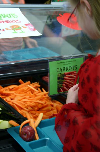 Children at Grant Elementary in Spokane's lower South Hill got a taste of Washington grown food from Othello and Cheney, Wash. on Wednesday's salad bar. (Lorie Hutson)