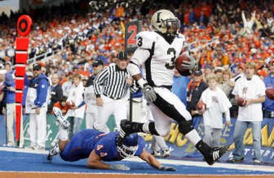 
Idaho's Deonte Jackson scores a touchdown against Boise State. Associated Press
 (Associated Press / The Spokesman-Review)