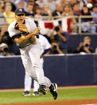 
Yankees third baseman Alex Rodriguez makes a leaping throw to get Twins' Shannon Stewart at first base.
 (Associated Press / The Spokesman-Review)