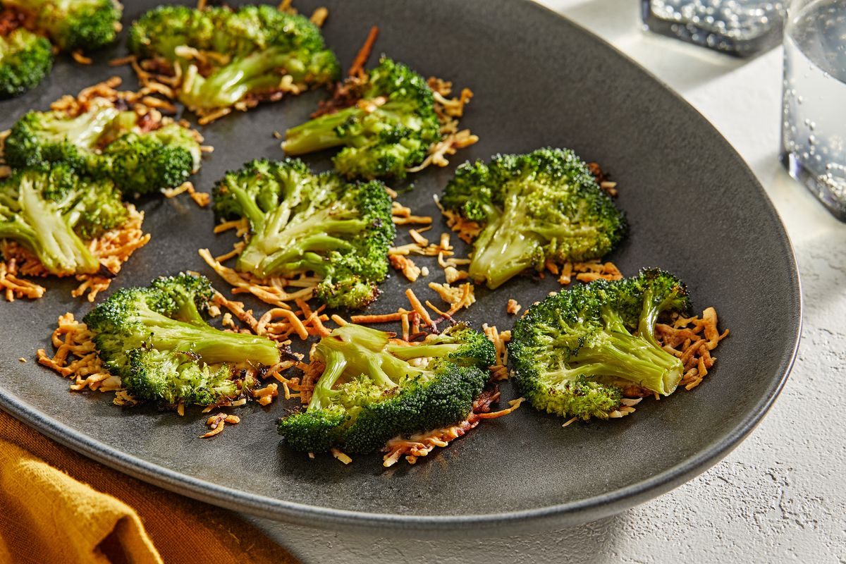 Roasted broccoli on a bed of crispy, savory Parmesan.  (Tom McCorkle/For The Washington Post)