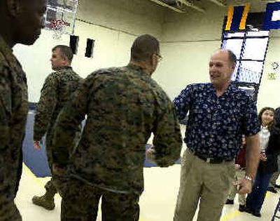 
After receiving his Purple Heart medal for injuries received during the Vietnam War, William B. Schoville is congratulated by his fellow U.S. Marines after the ceremony held Monday at the Naval Reserve Training Center. 
 (Colin Mulvany / The Spokesman-Review)