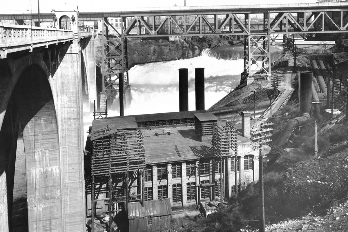 1920: The former Monroe Street Dam powerhouse was built on the south bank of the Spokane River next to the bridge’s foundation. The land later became Huntington Park. The Monroe Street Dam is the oldest continuously operating hydroelectric plant in Washington. (Spokesman-Review photo archives)