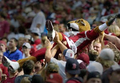 Butch the Cougar often gives a lift to Washington State fans, so Cougars fans returned the favor during last month's game against Colorado.
(Christopher Anderson/ / The Spokesman-Review)