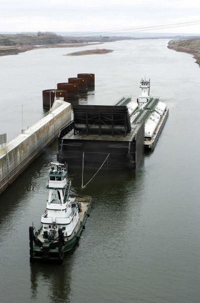 
This salmon-passage spillway weir is being towed upstream to be installed at Ice Harbor Dam on the lower Snake River as part of conservation efforts.
 (Associated Press / The Spokesman-Review)