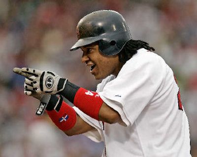 
Manny Ramirez signals to the dugout after his pinch-hit single during the eighth inning of Sunday's win over Minnesota. 
 (Associated Press / The Spokesman-Review)