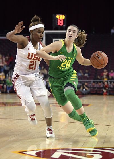 Oregon’s Sabrina Ionescu, right, drives toward the basket as Southern California’s Aliyah Mazyck defends during the first half of an NCAA college basketball game Friday, Jan. 11, 2019, in Los Angeles. (Mark J. Terrill / Associated Press)