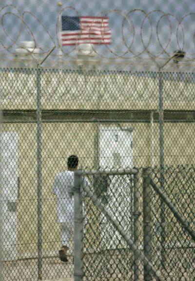 
In this image reviewed by the U.S. military, an unidentified detainee walks  at Camp 4, a medium security facility, on Saturday at Guantanamo Bay. 
 (Associated Press / The Spokesman-Review)