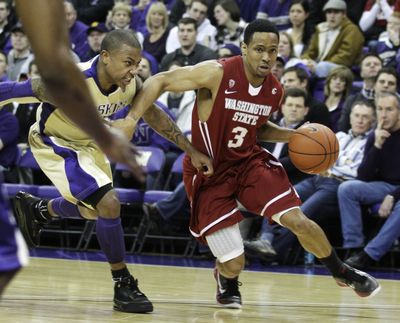WSU’s Reggie Moore, right, and Washington’s Isaiah Thomas meet on the court and on Twitter. (Associated Press)