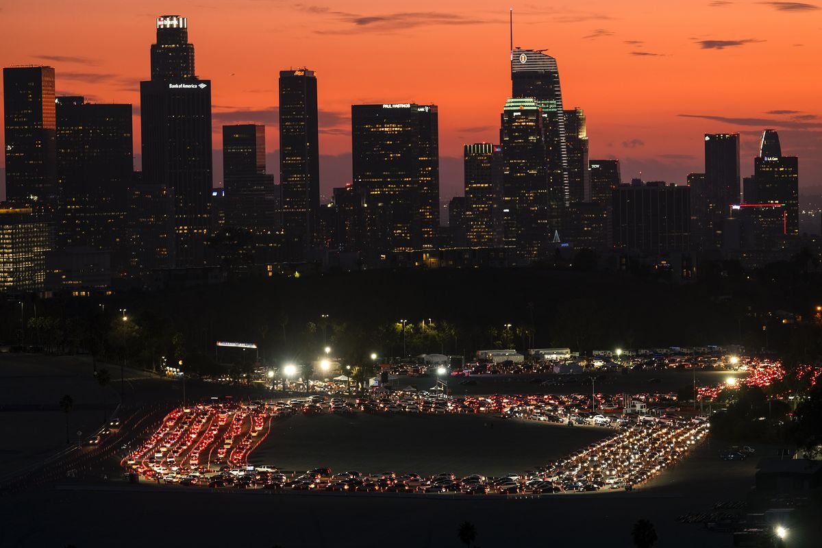 Motorists wait in lines to take a coronavirus test in a parking lot at Dodger Stadium, Monday, Jan. 4, 2021, in Los Angeles.  (Ringo H.W. Chiu)