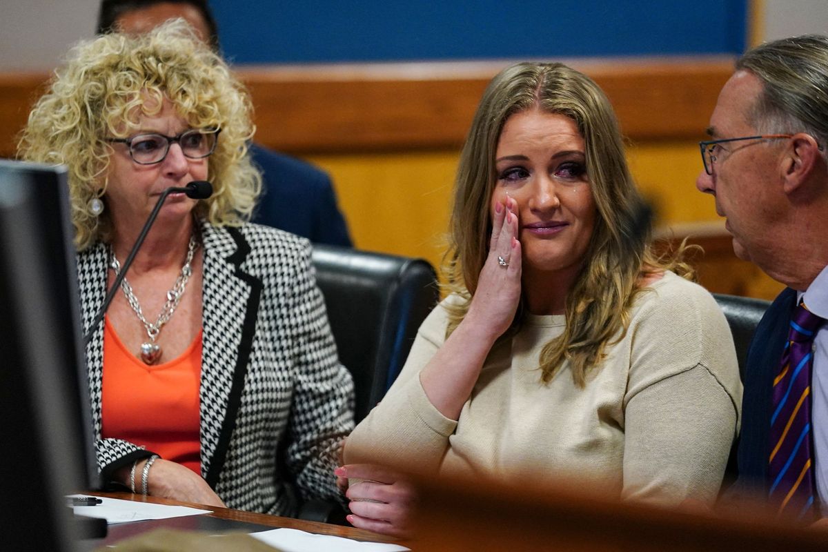 Jenna Ellis reacts with her lawyers Tuesday after reading a statement pleading guilty to one felony count of aiding and abetting false statements and writings inside Fulton Superior Court Judge Scott McAfee’s Fulton County Courtroom in Atlanta.  (John Bazemore/Pool/AFP)