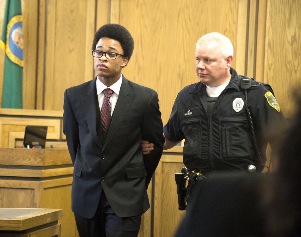 Demetruis Glenn, 17, is led into court Thursday before being sentenced for his role in the killing of World War II veteran Delbert “Shorty” Belton in 2013. (Jesse Tinsley)