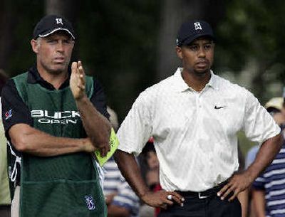 
Tiger Woods listens when his caddie Steve Williams, left, has something to say, here at last week's Buick Open.
 (Associated Press / The Spokesman-Review)